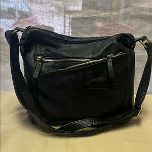 Sleek Black Leather Shoulder Bag with Gold Brass Zipper Accents
